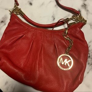 Red pebbled leather Michael kors bag